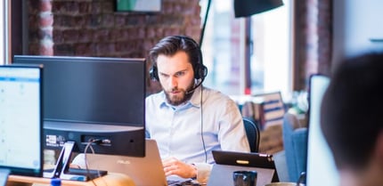 selective-focus-photo-of-man-in-official-shirt-sitting-in-2451645-2-750x365